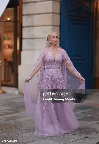 Palina Kozyrava seen wearing Natkina silver / pink diamond earrings, Rami Al Ali pastel lilac / purple embroidered belted transparent tulle long...