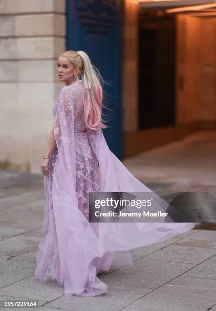 Palina Kozyrava seen wearing Natkina silver / pink diamond earrings, Rami Al Ali pastel lilac / purple embroidered belted transparent tulle long...