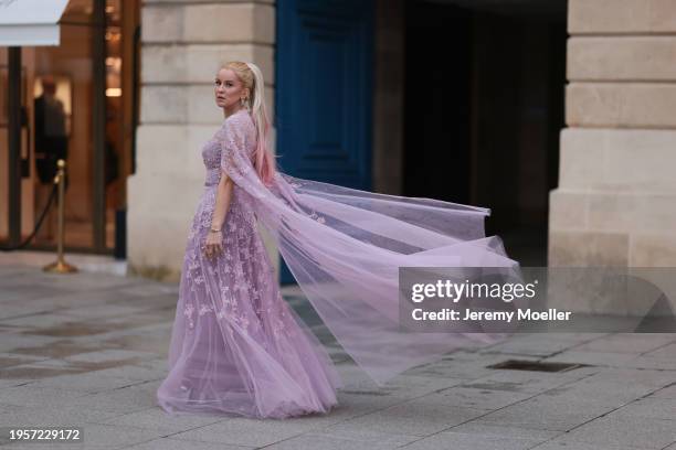 Palina Kozyrava seen wearing Natkina silver / pink diamond earrings, Rami Al Ali pastel lilac / purple embroidered belted transparent tulle long...