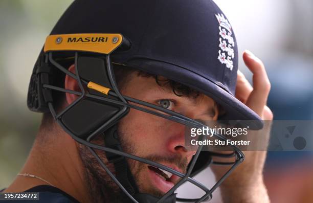 England wicketkeeper Ben Foakes wearing his batting helmet looks on during the England Net Session at Rajiv Gandhi International Stadium on January...