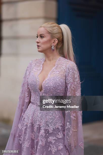 Palina Kozyrava seen wearing Natkina silver / pink diamond earrings, Rami Al Ali pastel lilac / purple embroidered belted transparent tulle long...