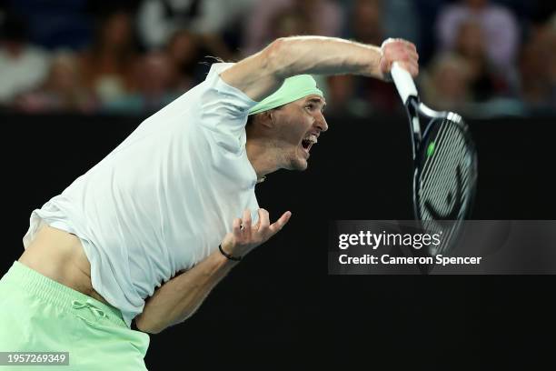 Alexander Zverev of Germany serves during their quarterfinals singles match against Carlos Alcaraz of Spain during the 2024 Australian Open at...