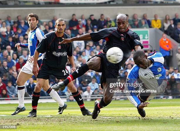 Andy Cole of Blackburn Rovers gets his head to the ball ahead of Richard Rufus of Charlton Athletic during the FA Barclaycard Premiership match held...