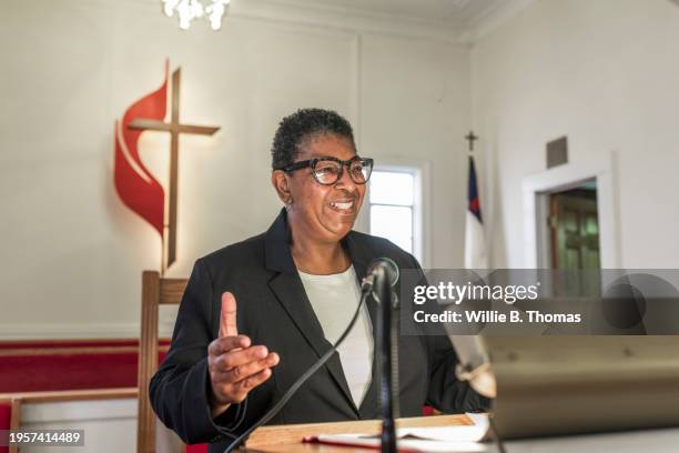 joyful preacher sharing sermon in church - pulpit stock pictures, royalty-free photos & images