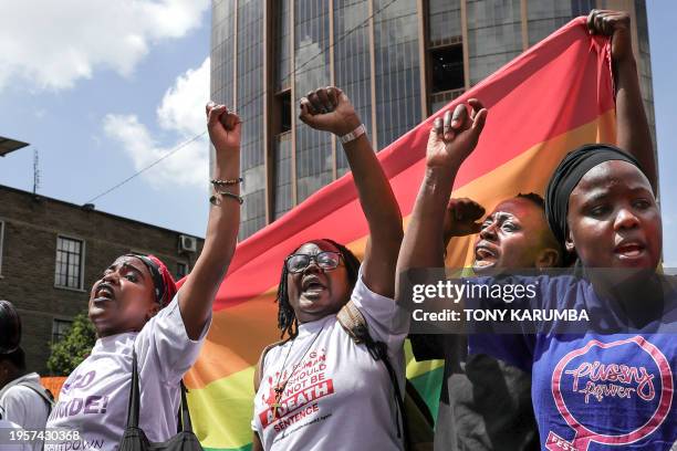 Activists gesture as they march through the Central Business District at a demonstration against an alarming rise in murders of young women in...