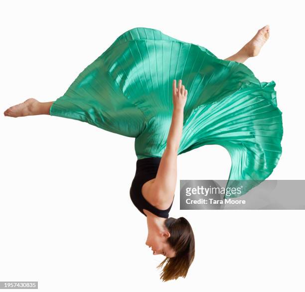 woman jumping in midair - green skirt stock pictures, royalty-free photos & images