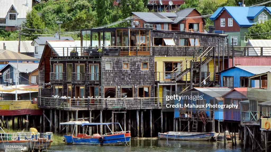 Focus on the stilt houses along the river Gamboa in Castro, Chile