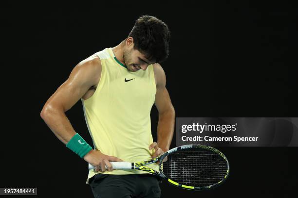 Carlos Alcaraz of Spain reacts during their quarterfinals singles match against Alexander Zverev of Germany during the 2024 Australian Open at...