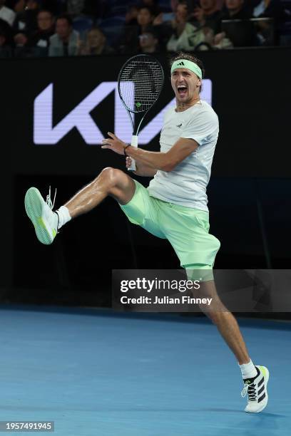 Alexander Zverev of Germany celebrates winning match point during their quarterfinals singles match against Carlos Alcaraz of Spain during the 2024...