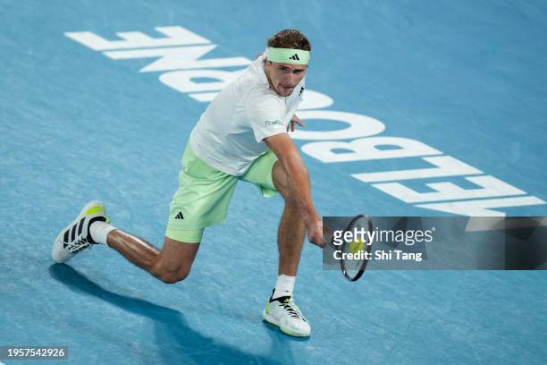 Alexander Zverev of Germany plays a backhand in the Men's Singles Quarter Finals match against Carlos Alcaraz of Spain during day eleven of the 2024...