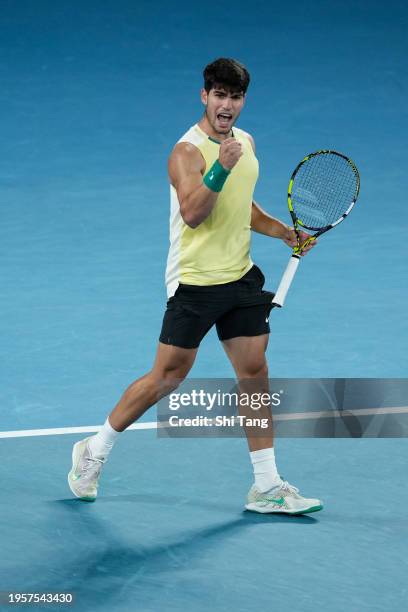 Carlos Alcaraz of Spain reacts in the Men's Singles Quarter Finals match against Alexander Zverev of Germany during day eleven of the 2024 Australian...