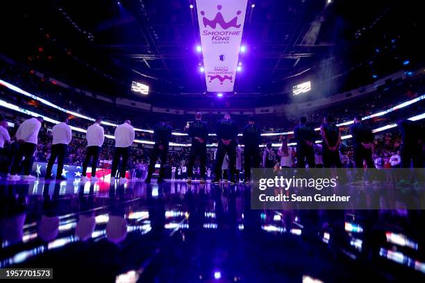 New Orleans Pelicans players stand on the court prior to the start an NBA game against the Utah Jazz at Smoothie King Center on January 23, 2024 in...