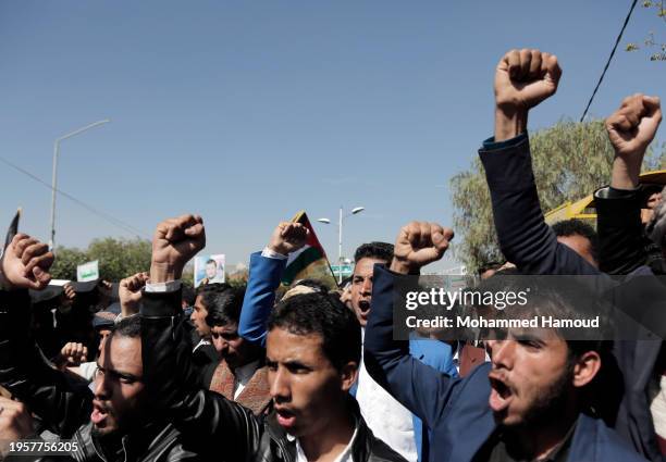 Yemenis shout anti-US, UK, and Israel slogans while participating in a protest staged against the U.S.-led sustained airstrikes on Yemen, authorizing...