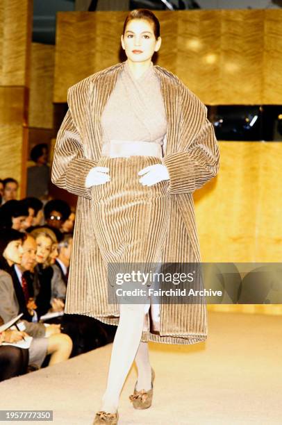 Model Cindy Crawford walks in the Perry Ellis Fall 1988 Ready to Wear Runway Show, in New York City.