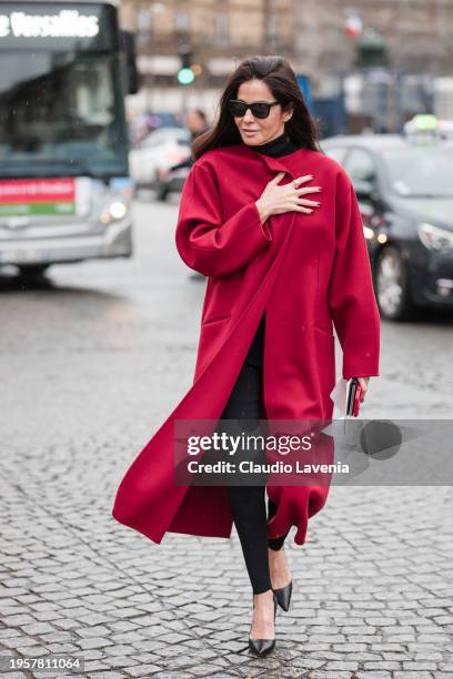 Barbara Martello wears red coat, black leggins, black heels, outside Chanel, during the Haute Couture Spring/Summer 2024 as part of Paris Fashion...