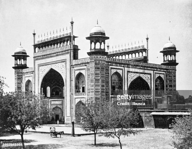 people and landmarks of india in 1895: taj mahal gate, accra - accra stock illustrations