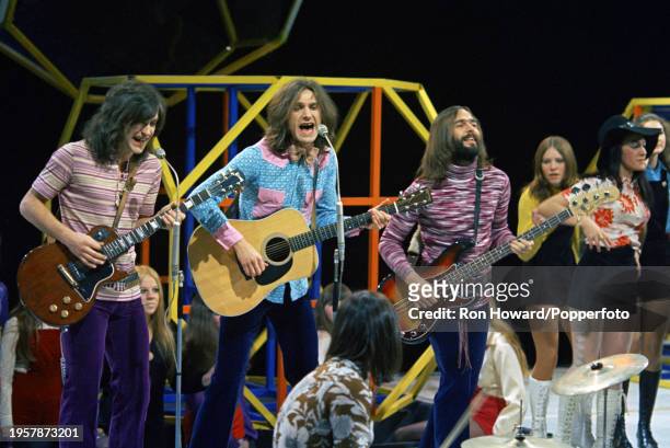 English rock group The Kinks perform in front of a studio audience on the set of a pop music television show in London on 1st February 1971. Members...