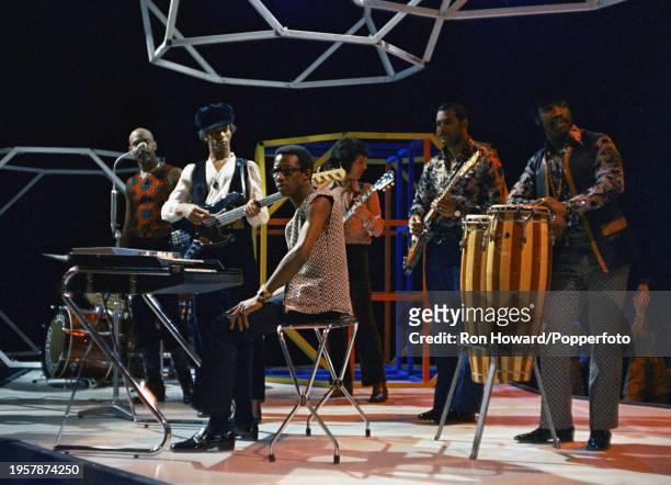 British soul group Hot Chocolate perform on the set of a pop music television show in London circa 1970. Members of the group are, from left, singer...