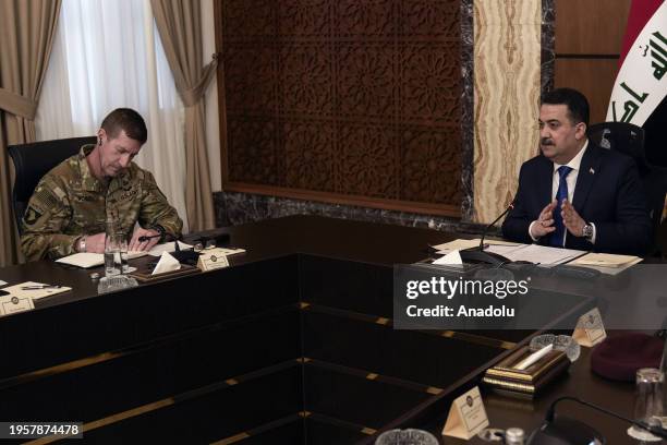 Iraqi Prime Minister Mohammed Shia al-Sudani chairs the first session of talks on the future of American and other foreign troops in the country, in...