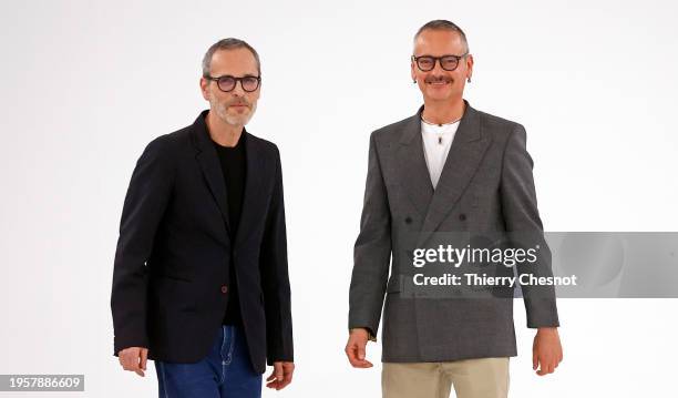 Dutch designers Viktor Horsting and Rolf Snoeren acknowledge the audience at the end of the Viktor & Rolf Haute Couture Spring/Summer 2024 show as...