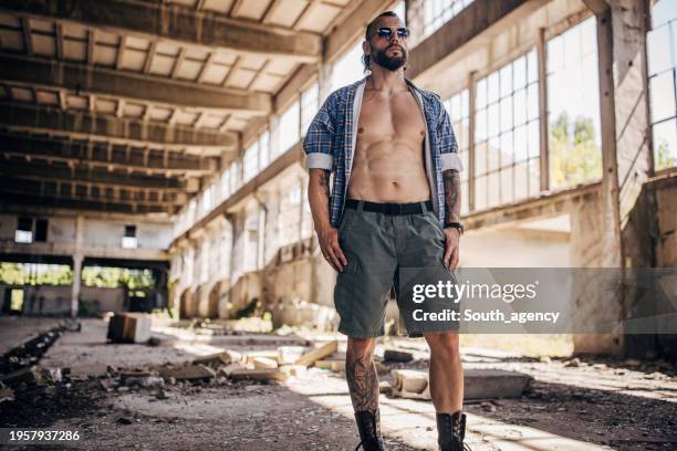 handsome man - unwanted tattoo stock pictures, royalty-free photos & images