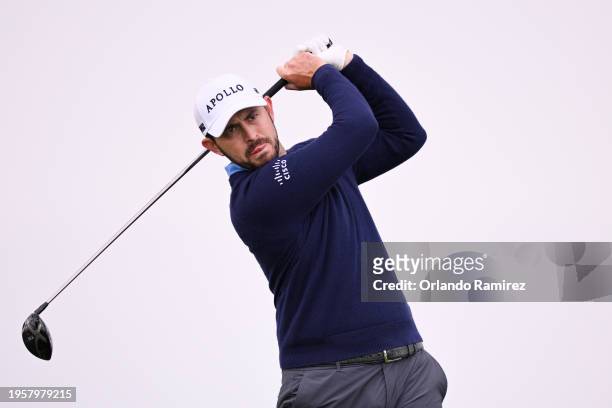 Patrick Cantlay of the United States hits his shot from the 11th tee during the first round of the Farmers Insurance Open on the Torrey Pines North...