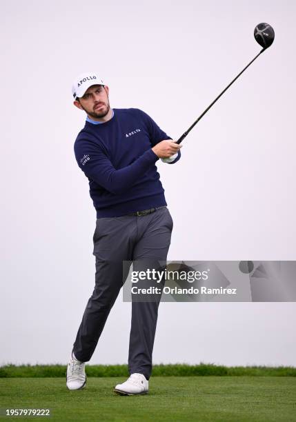 Patrick Cantlay of the United States hits his shot from the 11th tee during the first round of the Farmers Insurance Open on the Torrey Pines North...