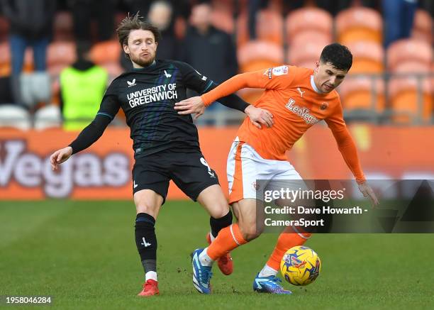 Blackpool's Albie Morgan battles with Charlton Athletic's Alfie May during the Sky Bet League One match between Blackpool and Charlton Athletic at...