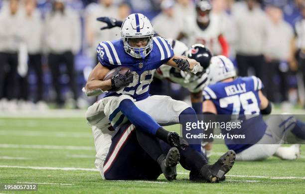 Jonathan Taylor of the Indianapolis Colts runs with the ball against the Houston Texans at Lucas Oil Stadium on January 06, 2024 in Indianapolis,...