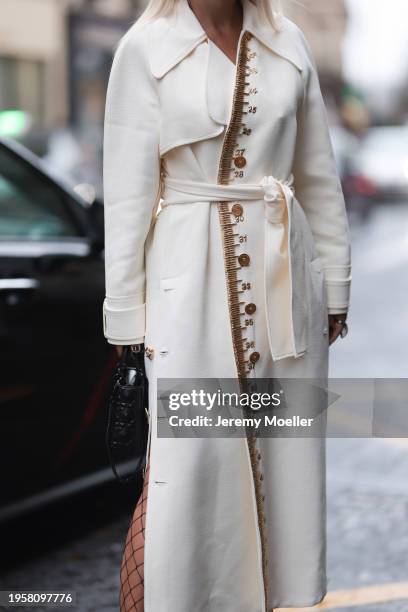 Corina Mihaila Larpin seen wearing Stefere Jewelry black / silver diamond rings, Schiaparelli cream white long wool coat with gold details, Dior...