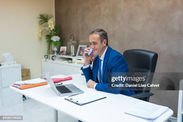 businessman using mobile in office - generation x stock pictures, royalty-free photos & images