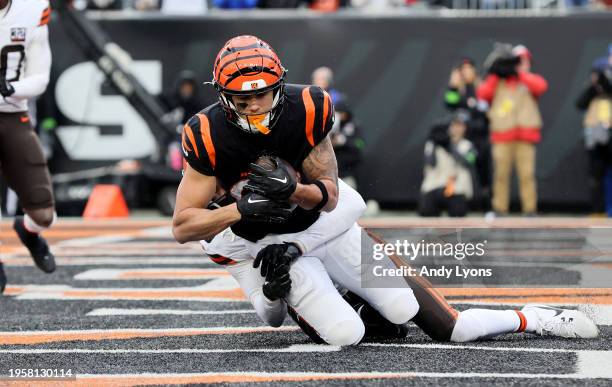 Andrei Iosivas of the Cincinnati Bengals catches a touchdown pass against the Cleveland Browns at Paycor Stadium on January 07, 2024 in Cincinnati,...