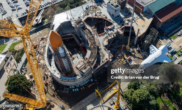 Los Angeles, CA The space shuttle Endeavour is wrapped in protective shrink wrap and is parked next to external fuel tanks and is anticipated to be...