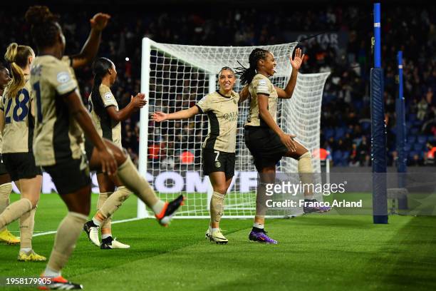 Marie-Antoinette Katoto of Paris Saint-Germain celebrates with teammates after scoring her team's first goal during the UEFA Women's Champions League...