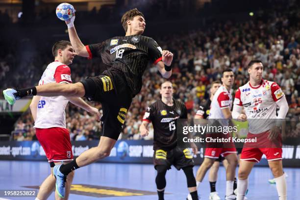 Julian Köster of Germany throws a goal during the Men's EHF Euro 2024 main round match between Germany and Croatia at Lanxess Arena on January 24,...