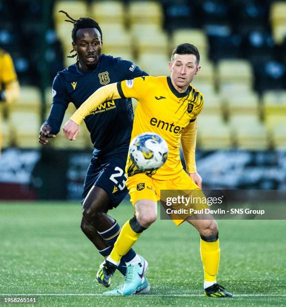 Dundee's Malachi Boateng and Livingston's Jason Holt in action during a cinch Premiership match between Livingston and Dundee at the Tony Macaroni...