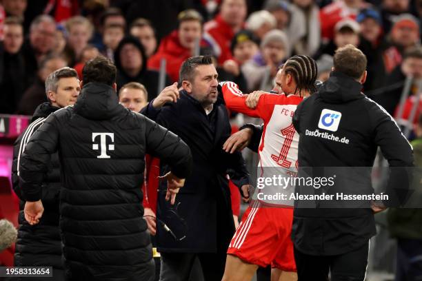 Nenad Bjelica, Head Coach of 1.FC Union Berlin, and Leroy Sane of Bayern Munich clash during the Bundesliga match between FC Bayern München and 1. FC...