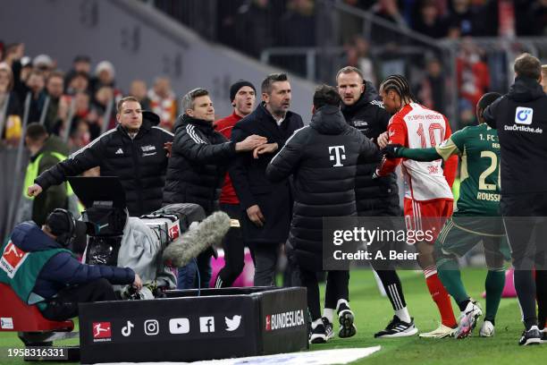 Nenad Bjelica, Head Coach of 1.FC Union Berlin, and Leroy Sane of Bayern Munich clash during the Bundesliga match between FC Bayern München and 1. FC...