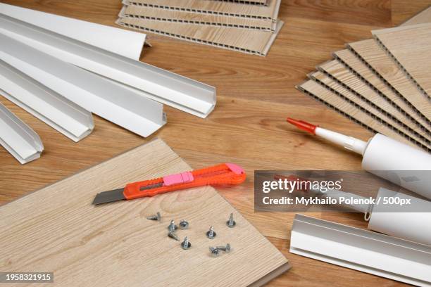 high angle view of work tools on table - linoleum table stock pictures, royalty-free photos & images