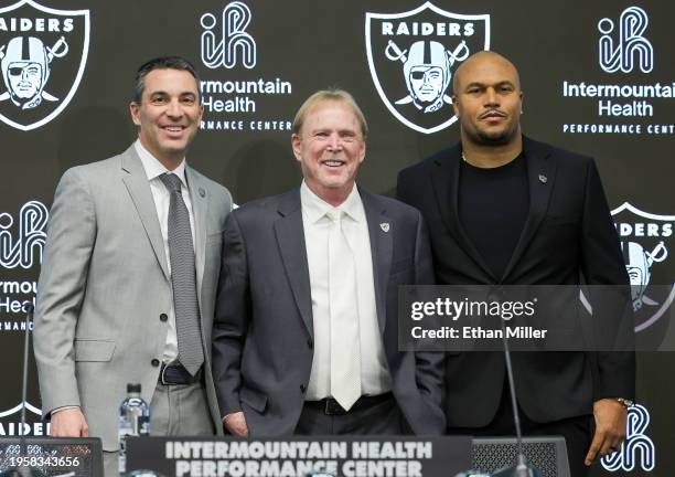 Owner and managing general partner Mark Davis of the Las Vegas Raiders poses for photos with Tom Telesco and Antonio Pierce during a news conference...