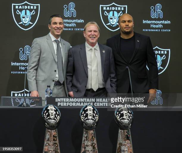 Owner and managing general partner Mark Davis of the Las Vegas Raiders poses for photos with Tom Telesco and Antonio Pierce during a news conference...
