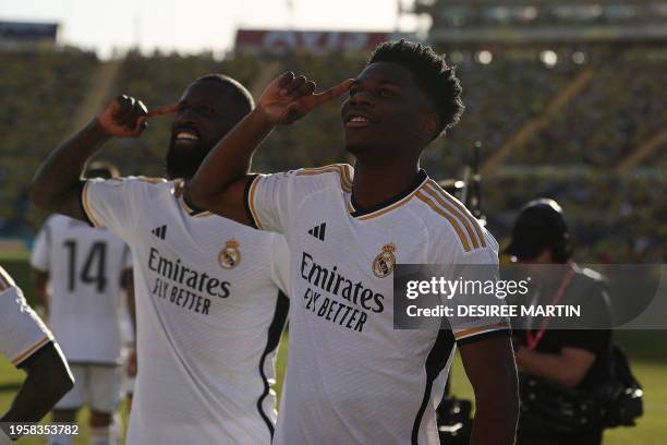 Real Madrid's French defender Aurelien Tchouameni celebrates with Real Madrid's German defender Antonio Rudiger after scoring his team's second goal...