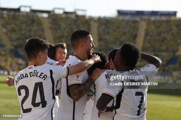 Real Madrid's French defender Aurelien Tchouameni celebrates with teammates after scoring his team's second goal during the Spanish league football...