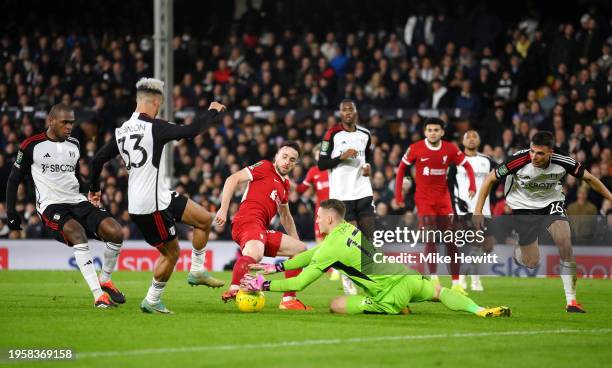 Bernd Leno of Fulham makes a save from Diogo Jota of Liverpool during the Carabao Cup Semi Final Second Leg match between Fulham and Liverpool at...