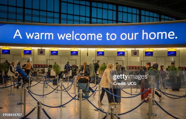 Business class passengers arrive for check-in with British Airways at London Heathrow airport Terminal 5, UK.