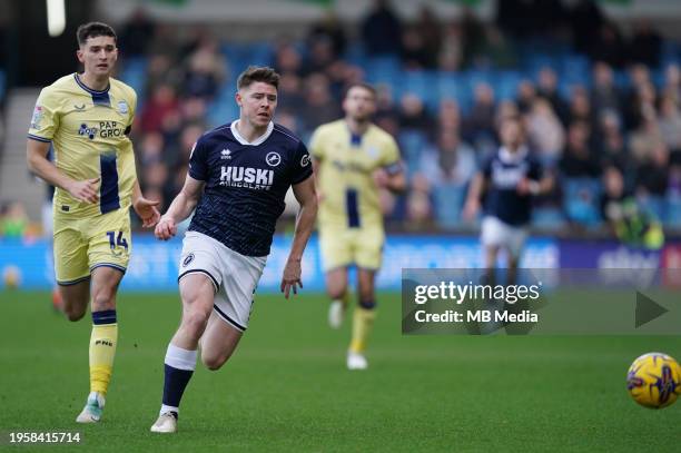 Kevin Nisbet of Millwall under pressure from Jordan Storey of Preston North End during the Sky Bet Championship match between Millwall and Preston...