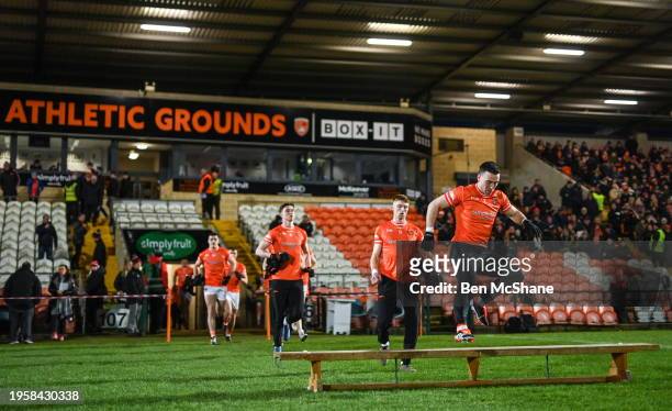Northern Ireland , United Kingdom - 27 January 2024; Armagh captain Aidan Forker jumps the bench before the Allianz Football League Division 2 match...