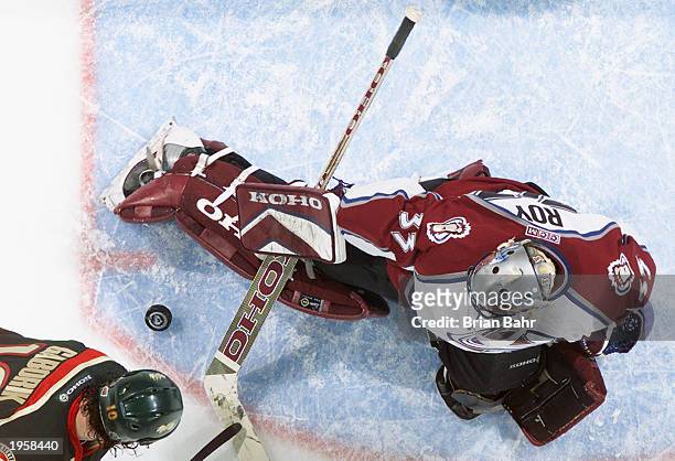 Goalie Patrick Roy of the Colorado Avalanche stops a shot by Marian Gaborik of the Minnesota Wild during game five of the first round of the 2003...
