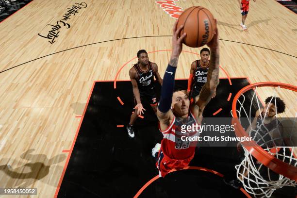 Kyle Kuzma of the Washington Wizards dunks the ball during the game against the Detroit Pistons on January 27, 2024 at Little Caesars Arena in...