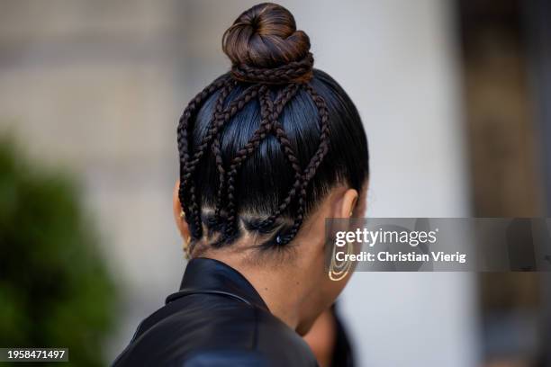 Guest with braided hair style outside Ziad Nakad during the Haute Couture Spring/Summer 2024 as part of Paris Fashion Week on January 24, 2024 in...